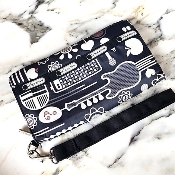 Lesportsac Handbags - Lesportsac Musical Black and White Clutch